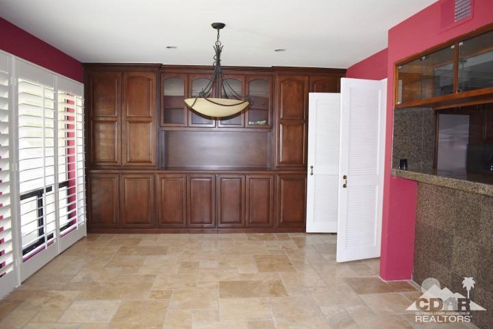 6243 East Driver Road Palm Springs, CA 92264 - Photo 4 of 14 a view of wooden floor and chandelier in a room