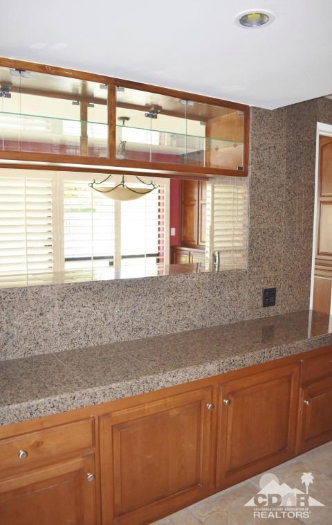 6243 East Driver Road Palm Springs, CA 92264 - Photo 7 of 14 a kitchen with granite countertop a sink and a window