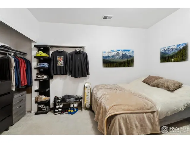 a bathroom with a sink toilet double vanity and tub