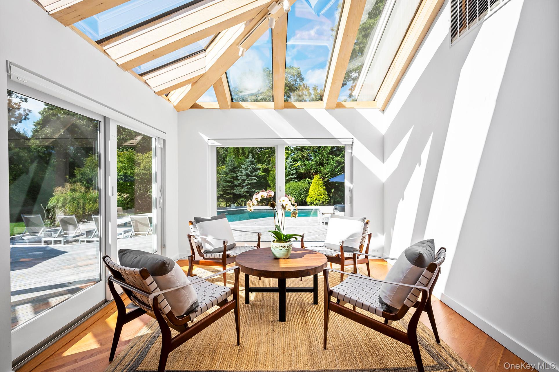 1 Acorn Path Quogue, NY 11959 - Photo 12 of 24 a living room with furniture and a window