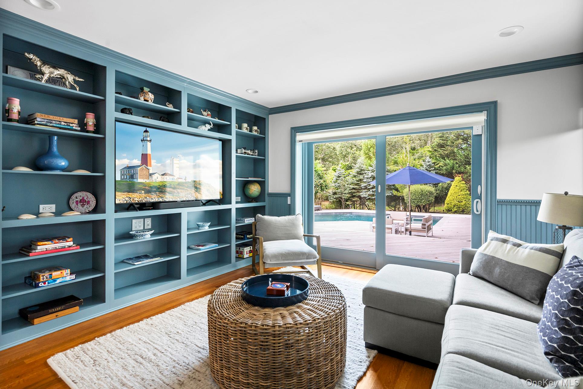 1 Acorn Path Quogue, NY 11959 - Photo 13 of 24 a living room with furniture and a flat screen tv