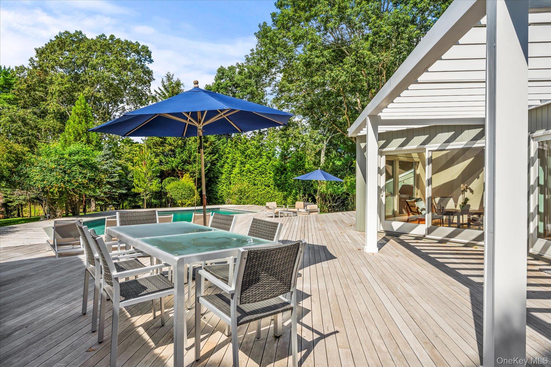 1 Acorn Path Quogue, NY 11959 - Photo 21 of 24 a view of a chairs and table in the balcony