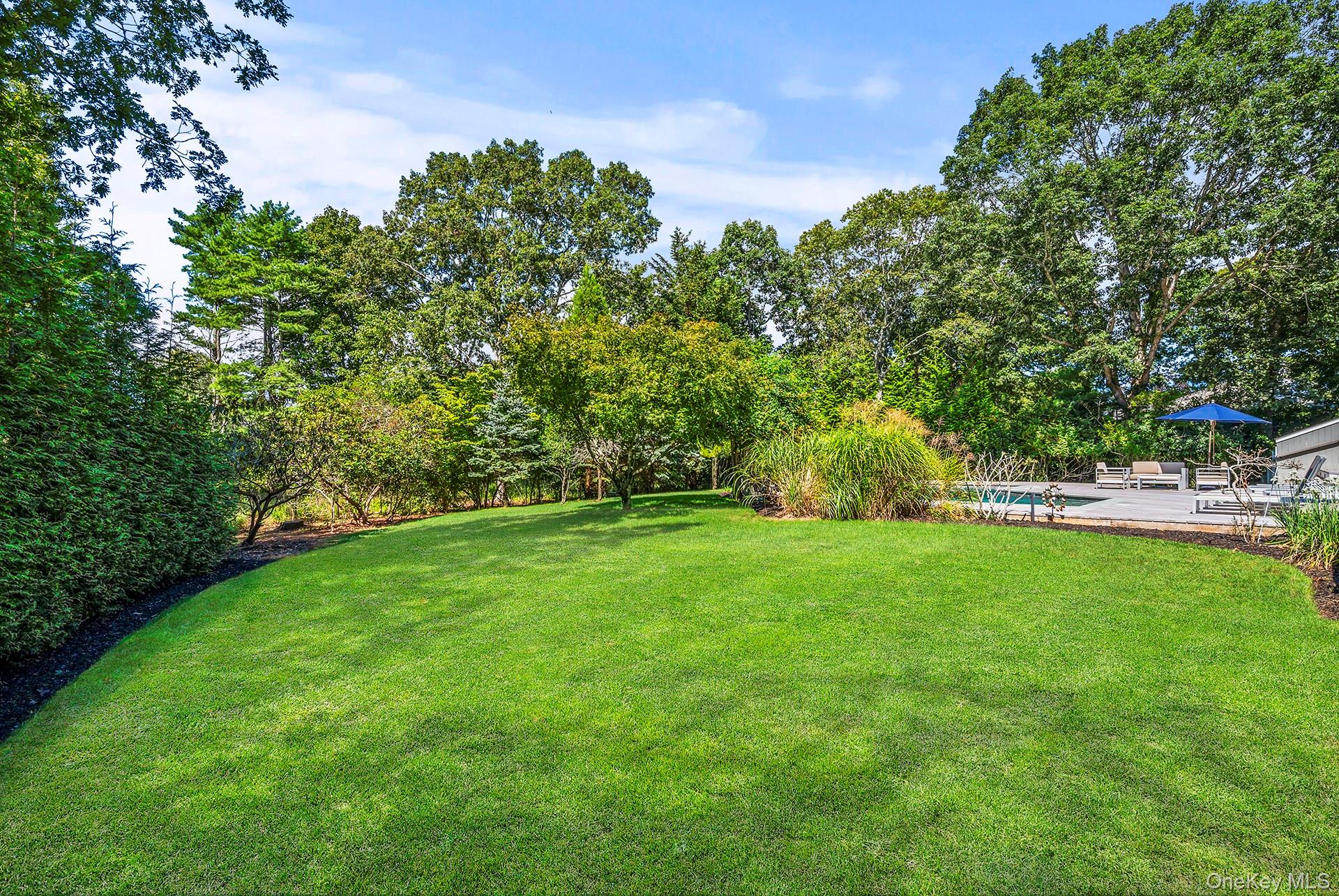 1 Acorn Path Quogue, NY 11959 - Photo 22 of 24 a view of green field