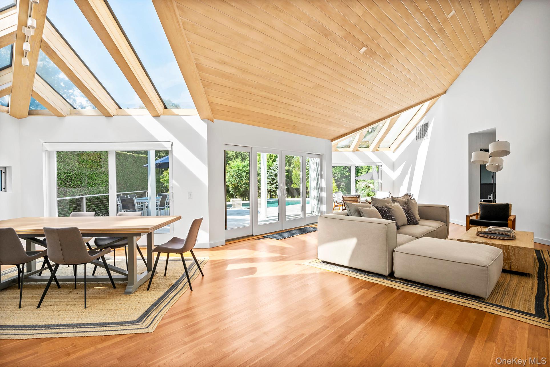 1 Acorn Path Quogue, NY 11959 - Photo 6 of 24 a living room with furniture and a large window