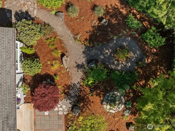 a front view of a house with yard and green space