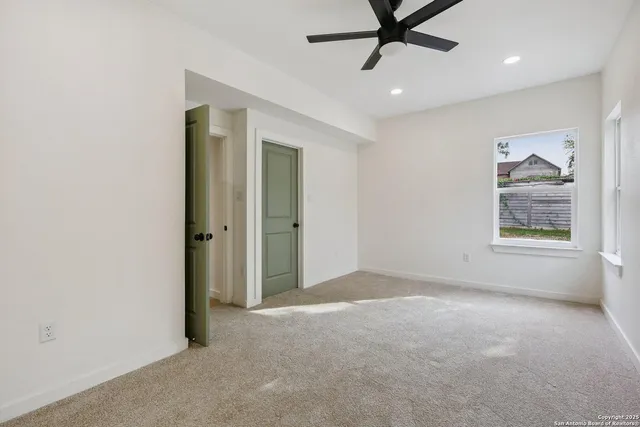 a view of an empty room and window