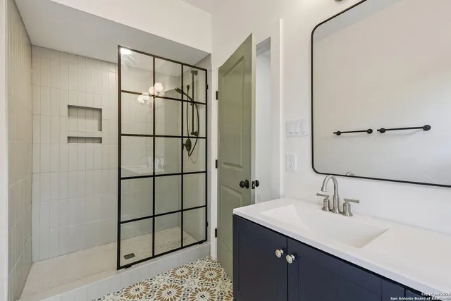 a bathroom with a sink and a mirror
