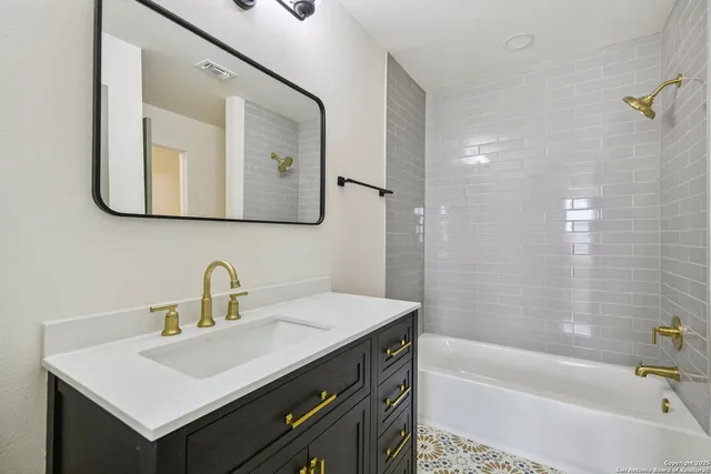 a bathroom with a sink and a bathtub
