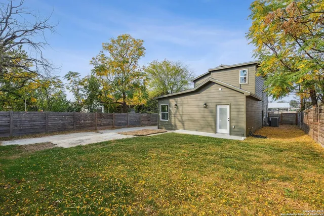 a backyard of a house with lots of green space