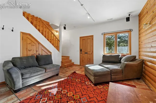 a kitchen with stainless steel appliances granite countertop a stove a sink and dishwasher with a dining table