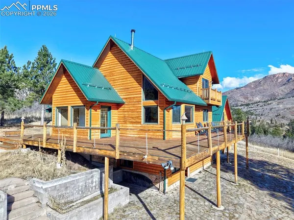 a front view of a house with a yard covered in snow