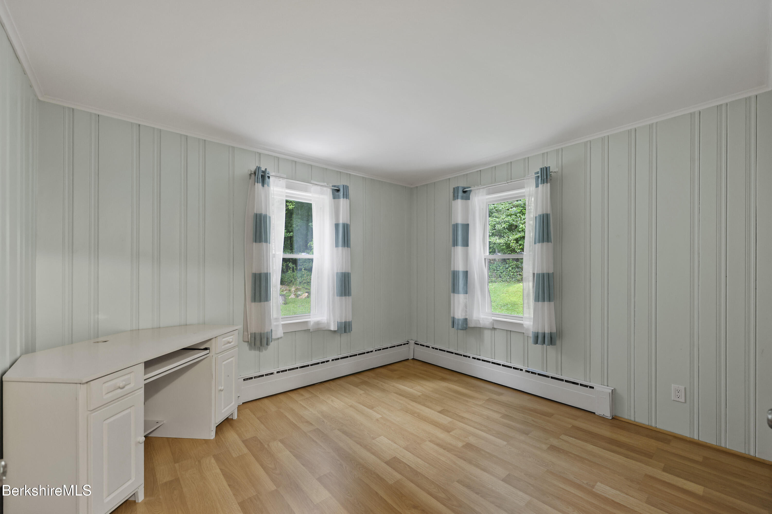 41 Deming Street Dalton, MA 01226 - Photo 21 of 35 an empty room with wooden floor and windows