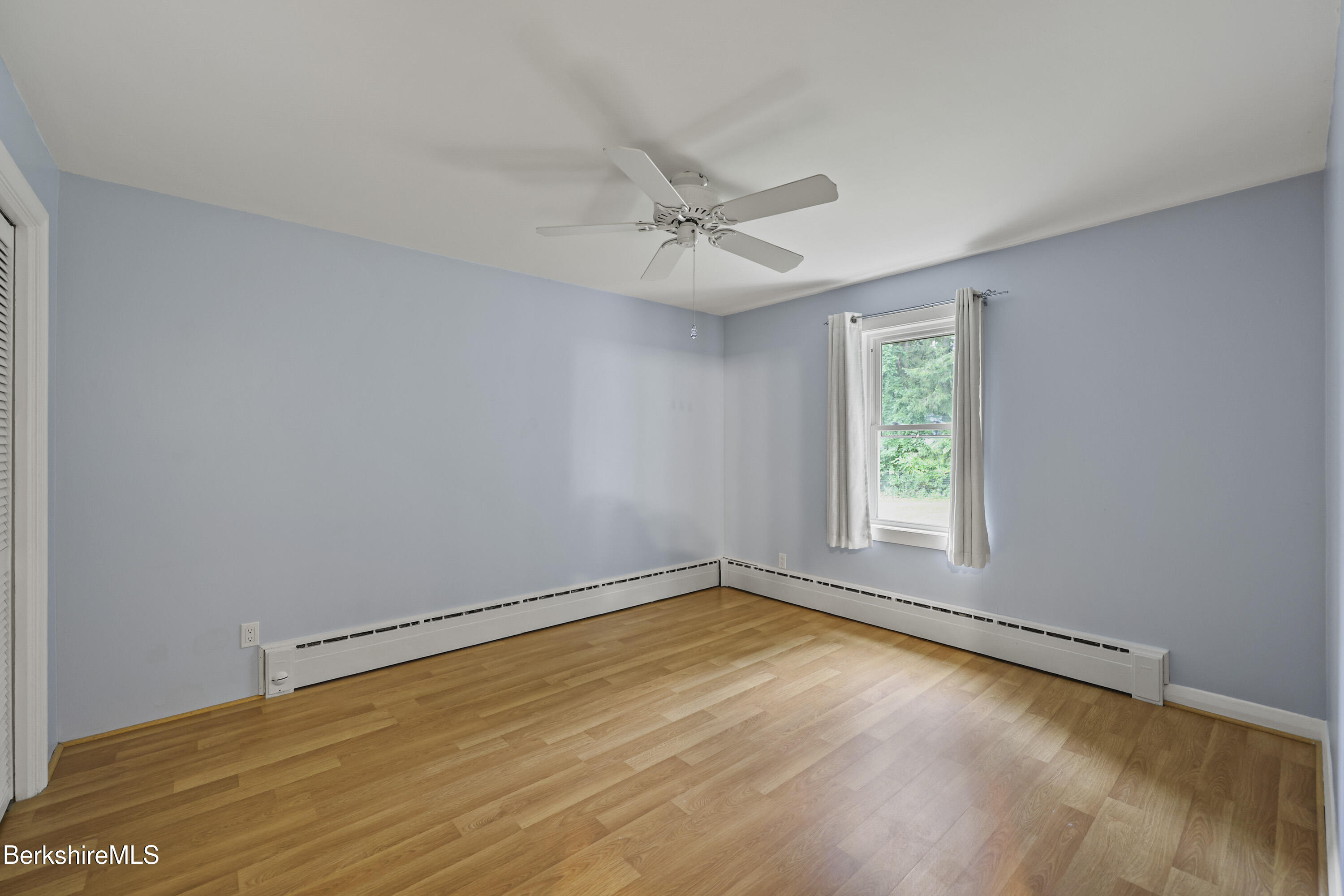41 Deming Street Dalton, MA 01226 - Photo 23 of 35 an empty room with a window and ceiling fan