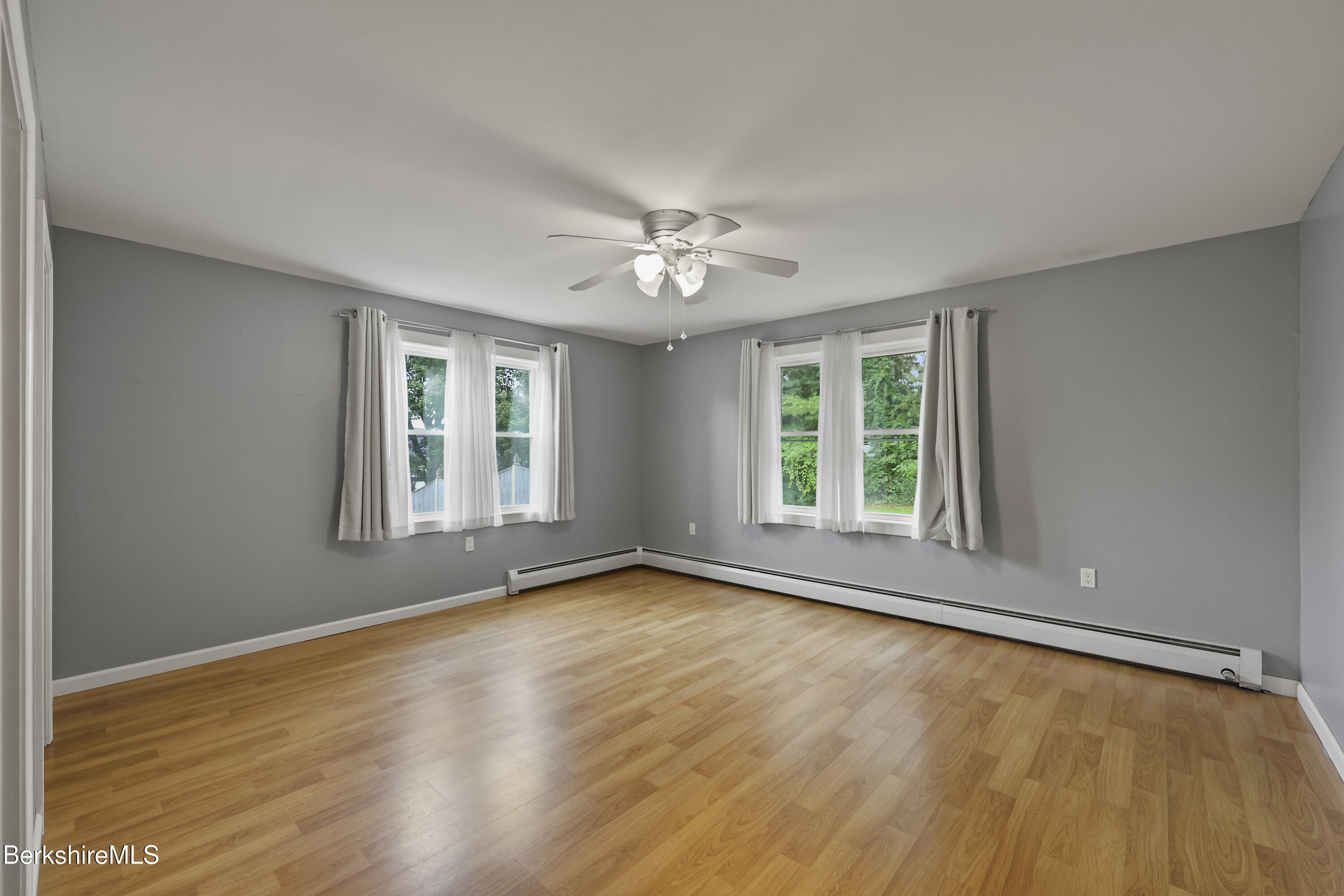 41 Deming Street Dalton, MA 01226 - Photo 27 of 35 a view of an empty room with a window and wooden floor