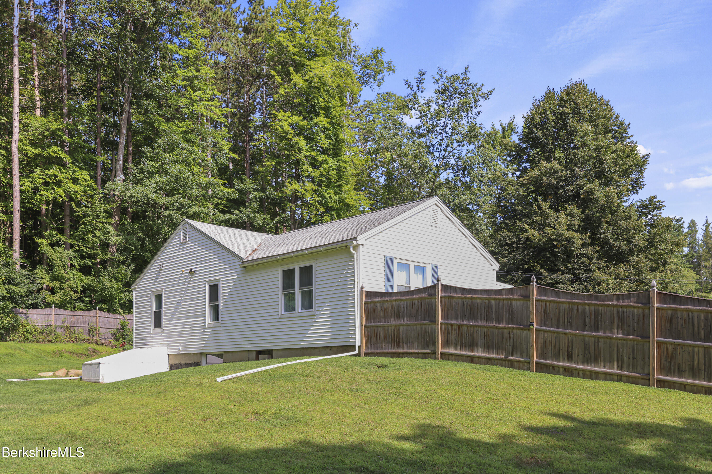 41 Deming Street Dalton, MA 01226 - Photo 5 of 35 a view of a house with a yard and sitting area