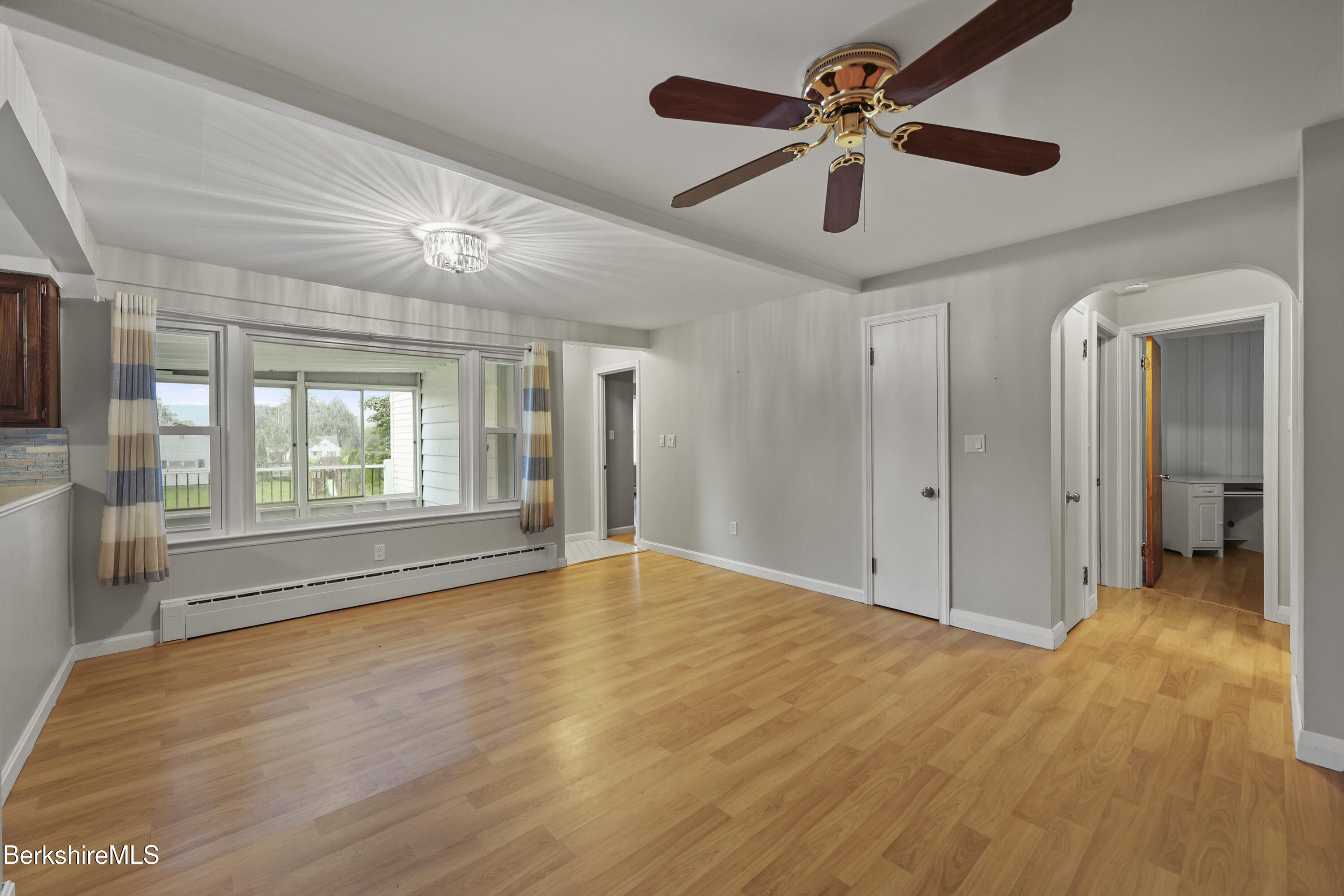41 Deming Street Dalton, MA 01226 - Photo 9 of 35 a view of an empty room with window and wooden floor