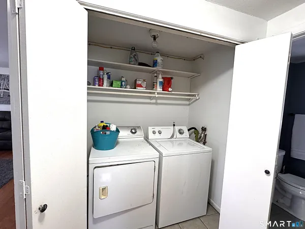 a utility room with dryer and washer