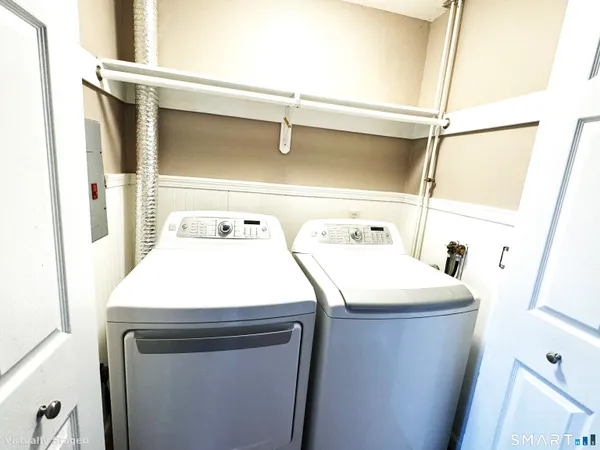 a utility room with dryer and washer