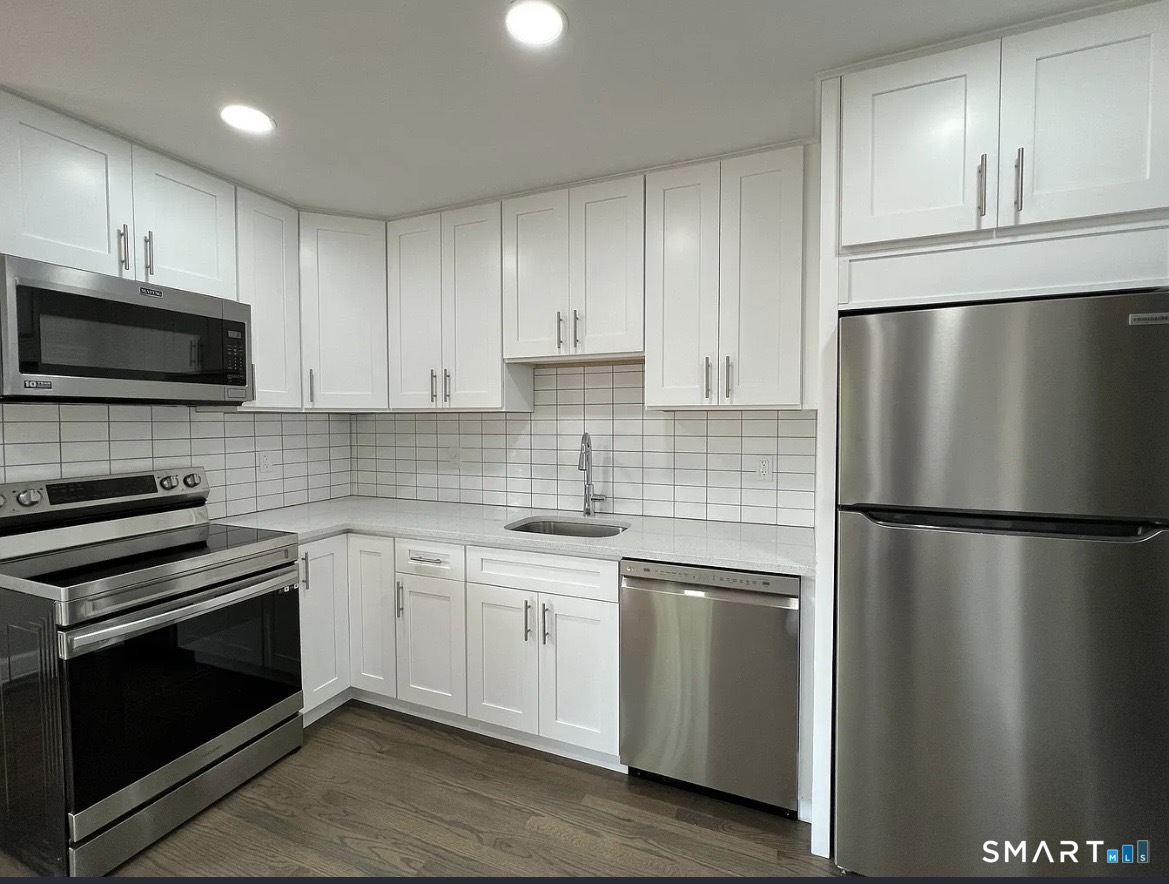270 R East Street Plainville, CT 06062 - Photo 4 of 28 a kitchen with a refrigerator sink and microwave