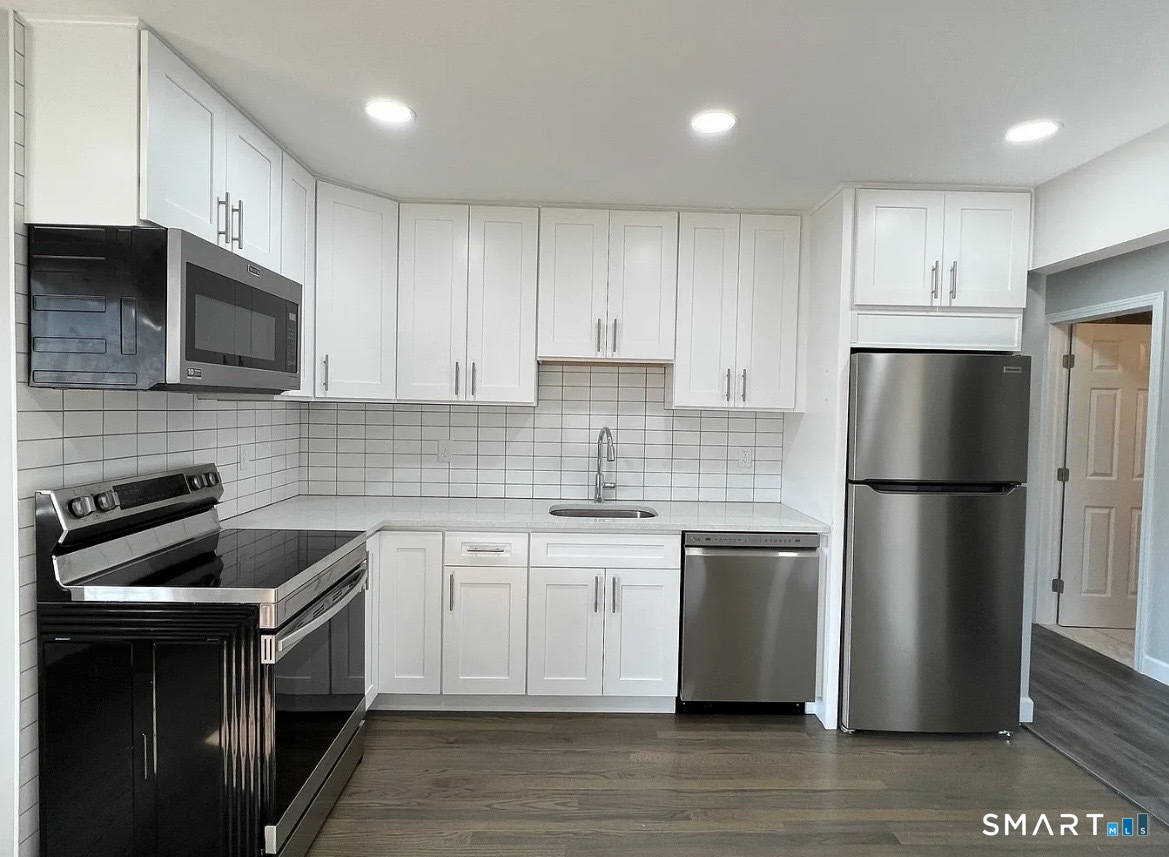 270 R East Street Plainville, CT 06062 - Photo 8 of 34 270 East Rear fully remodeled. Shaker white cabinets, SS aplliances.