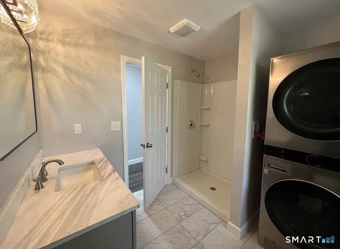 270 R East Street Plainville, CT 06062 - Photo 10 of 28 a bathroom with a sink a toilet and shower