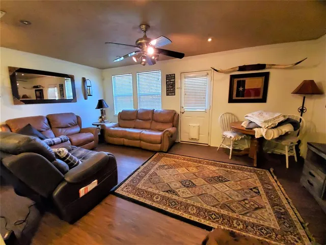 a living room with furniture and a rug
