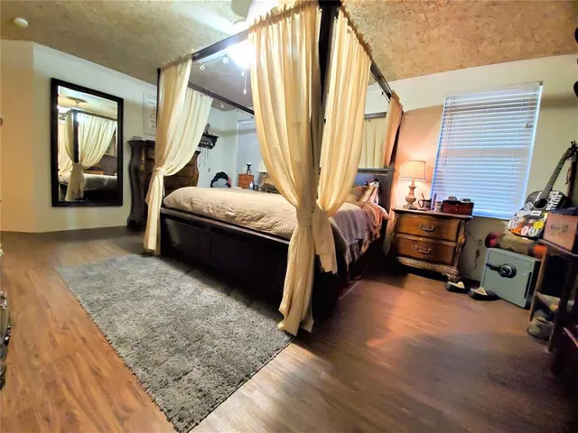 a bed room with a bed and a window