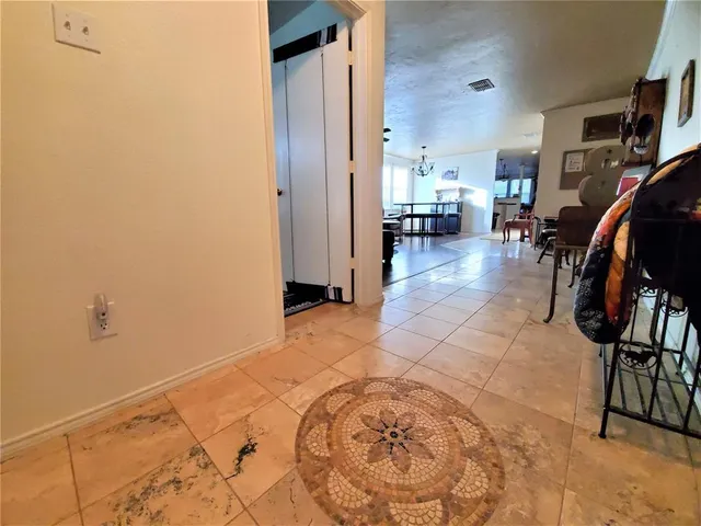 a view of living room filled with furniture and a window