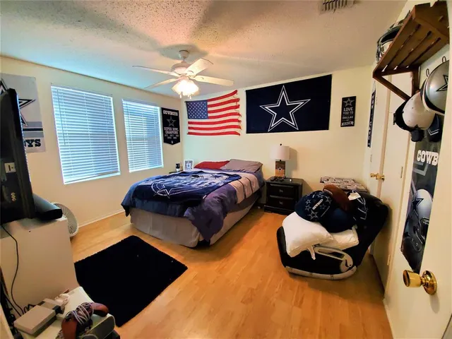 a bedroom with bed and window