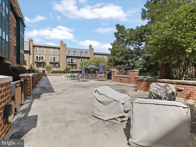 a view of a terrace with furniture and a fire pit
