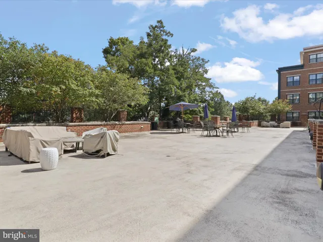 a view of outdoor space with seating area and trees around