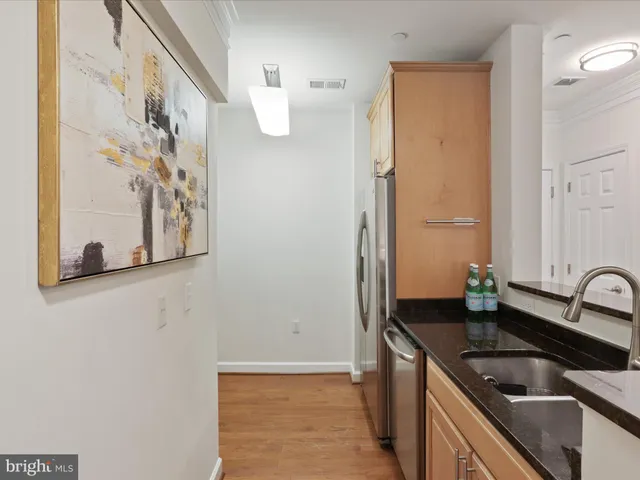 a kitchen with a sink and a refrigerator