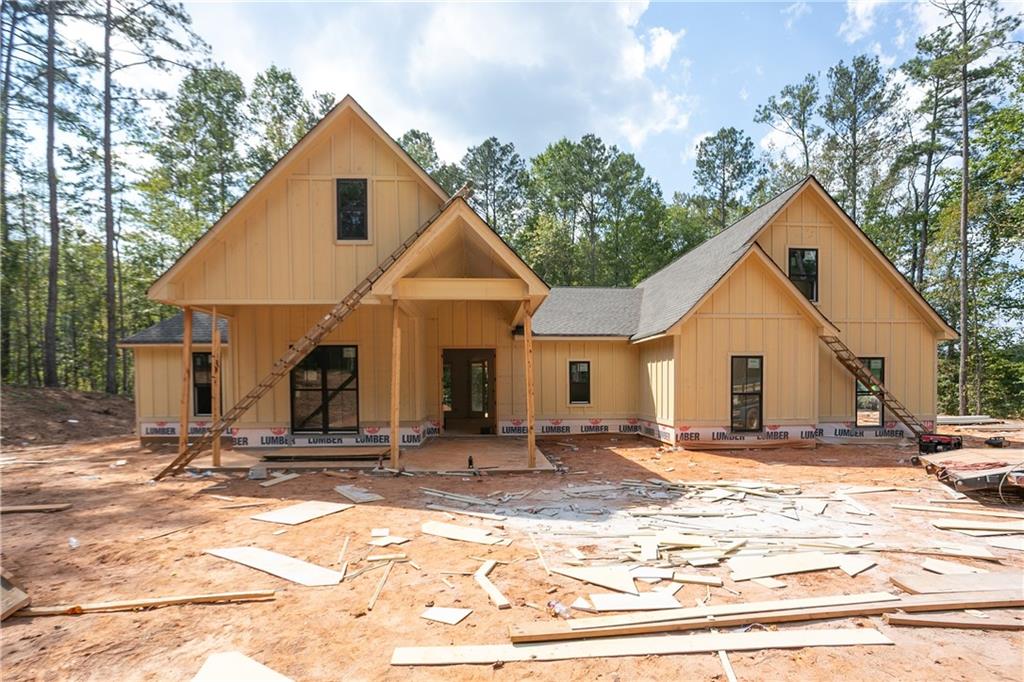 a view of a house with snow on the background