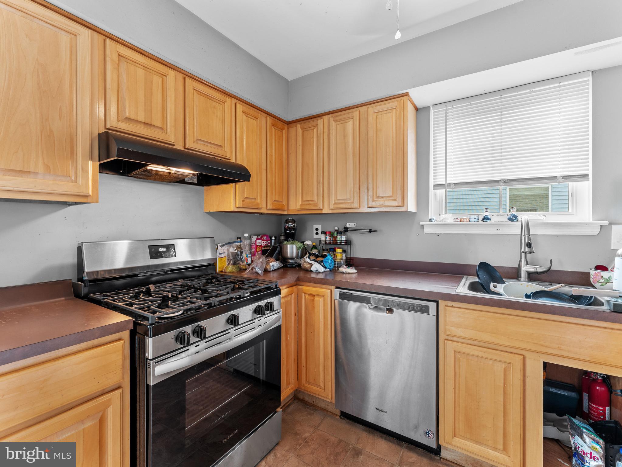 21 Maynard Drive Sicklerville, NJ 08081 - Photo 13 of 23 a kitchen with stainless steel appliances granite countertop a sink stove and cabinets