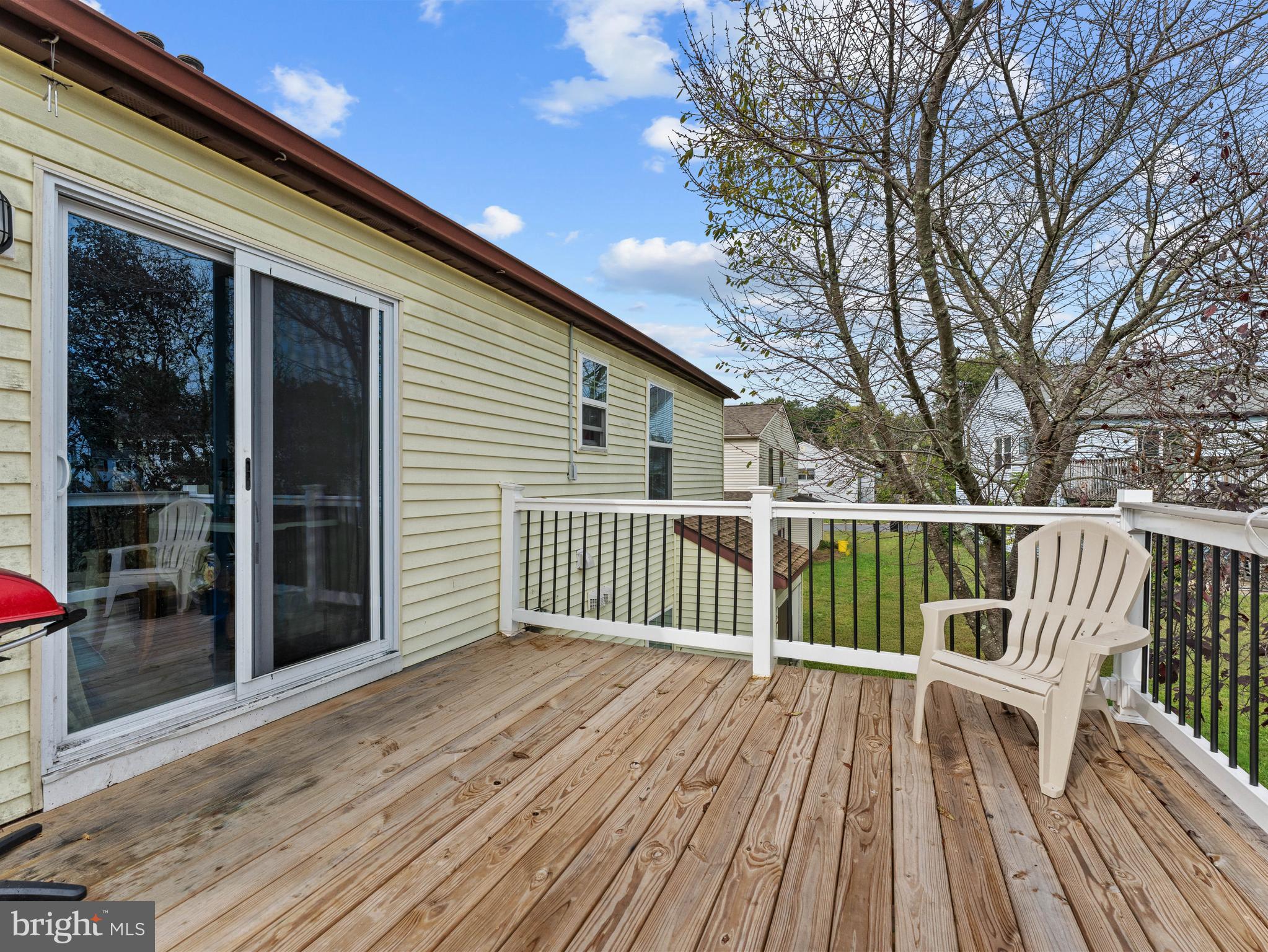 21 Maynard Drive Sicklerville, NJ 08081 - Photo 4 of 23 a view of deck with a large window and wooden floor