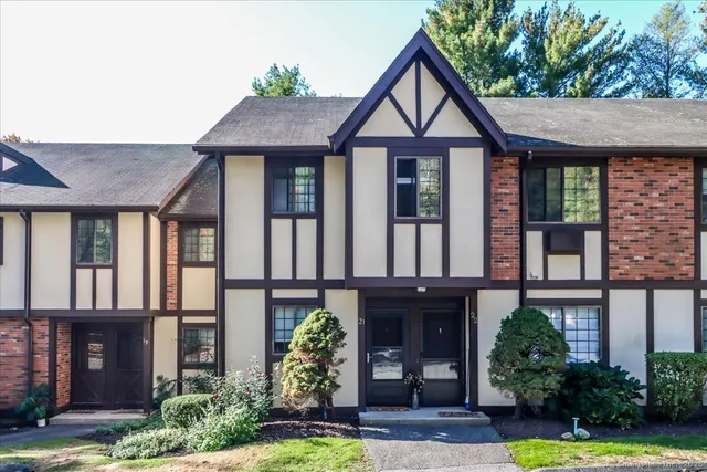 a front view of a house with garden