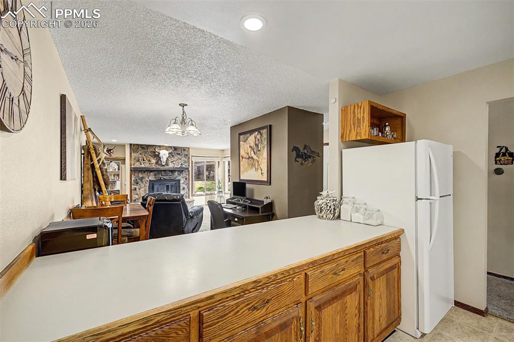 1140 Magic Lamp Way, Unit 3 Monument, CO 80132 - Photo 12 of 23 a view of living room with furniture and a flat screen tv