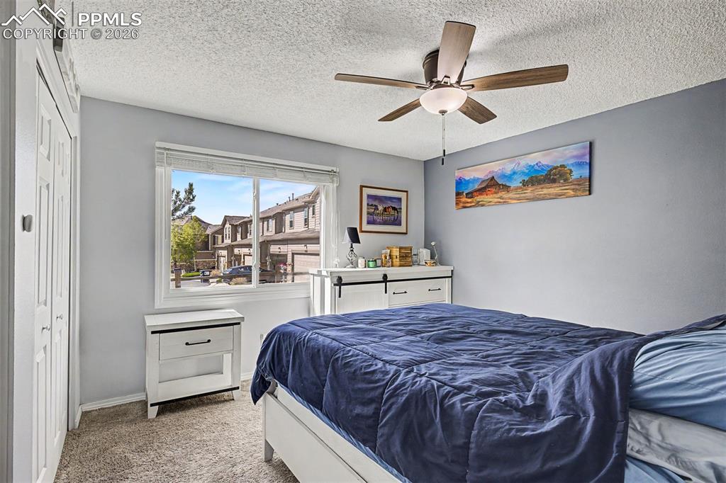 1140 Magic Lamp Way, Unit 3 Monument, CO 80132 - Photo 17 of 23 a bedroom with a bed and a window