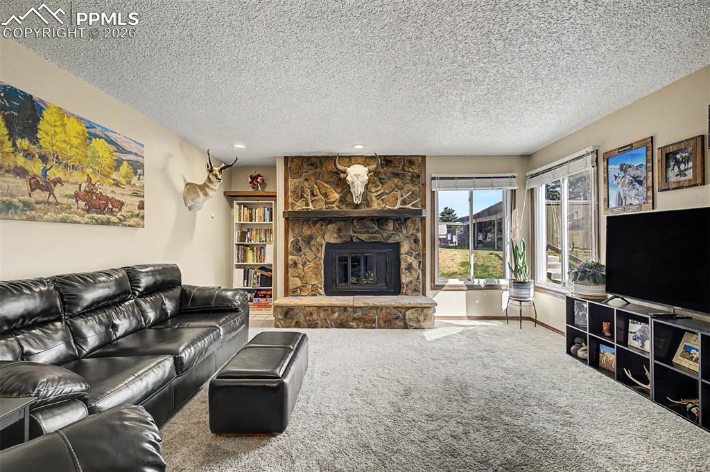 1140 Magic Lamp Way, Unit 3 Monument, CO 80132 - Photo 3 of 23 a living room with furniture and a flat screen tv