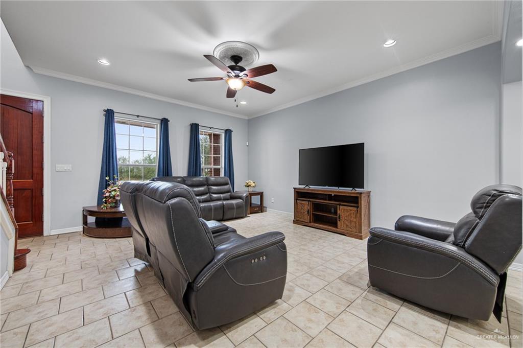 15474 Primera Road Harlingen, TX 78552 - Photo 11 of 45 a living room with furniture and a flat screen tv