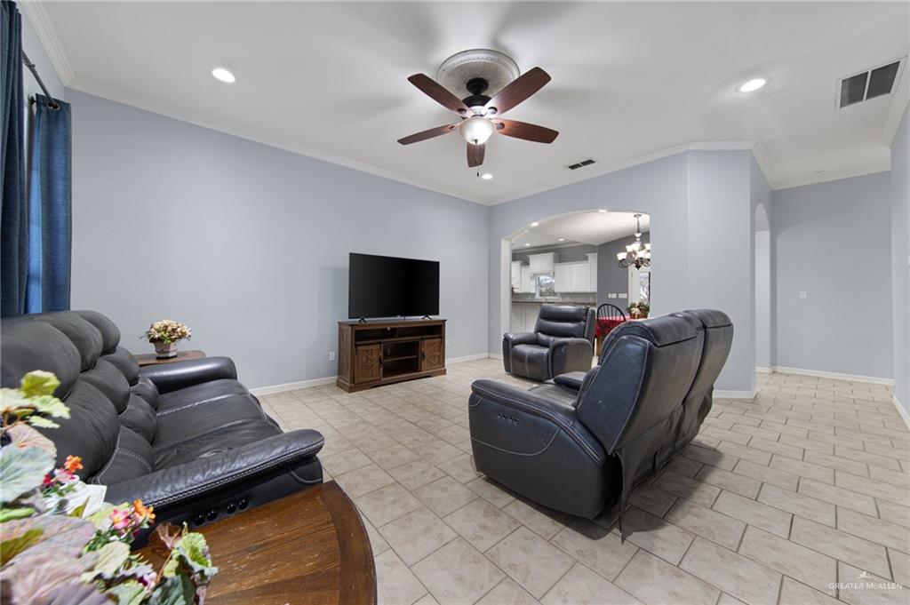 15474 Primera Road Harlingen, TX 78552 - Photo 12 of 45 a living room with furniture and a flat screen tv