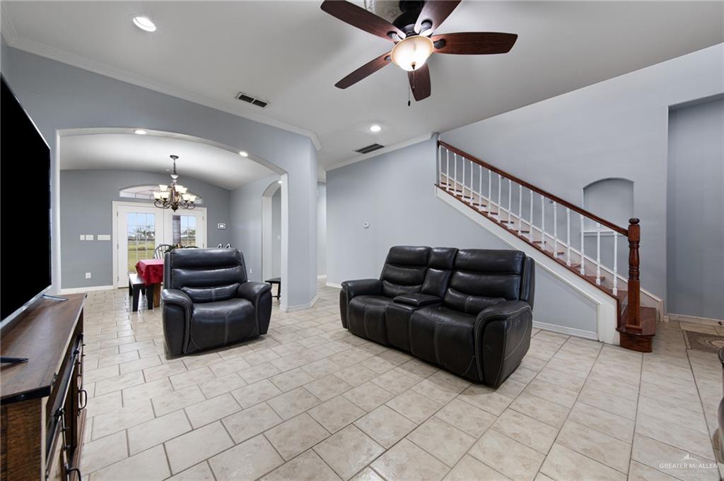 15474 Primera Road Harlingen, TX 78552 - Photo 13 of 45 a living room with furniture and stairs
