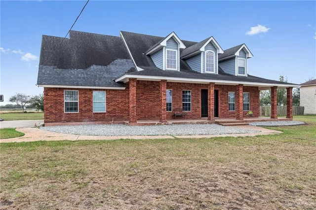 a view of a house with swimming pool and porch