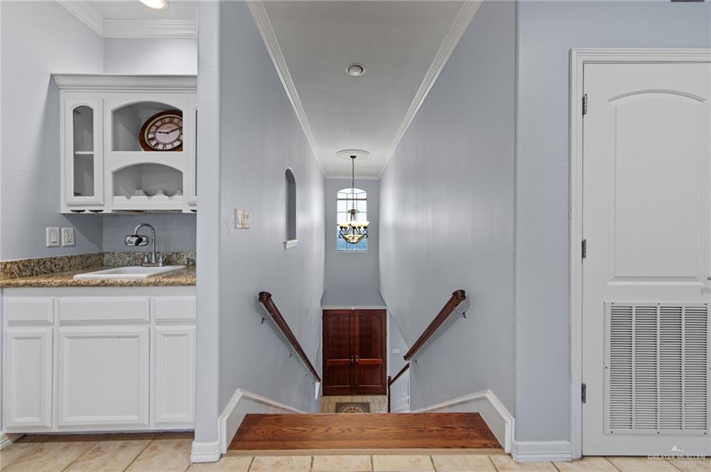 15474 Primera Road Harlingen, TX 78552 - Photo 28 of 45 a workspace with wooden floor and a rug