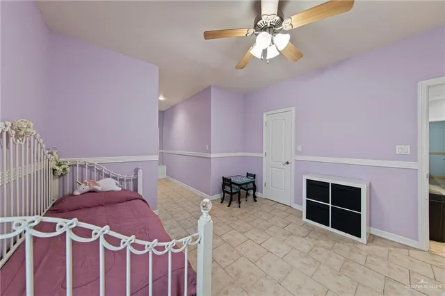 a bedroom with furniture and a chandelier