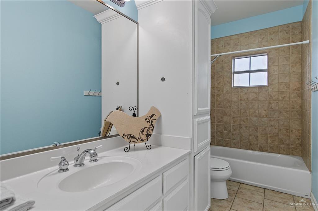 15474 Primera Road Harlingen, TX 78552 - Photo 34 of 45 a bathroom with a sink toilet and shower