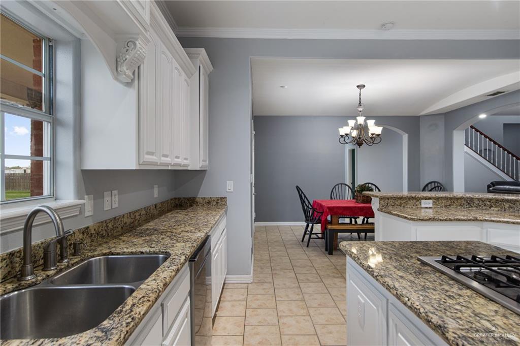 15474 Primera Road Harlingen, TX 78552 - Photo 7 of 45 a kitchen with stainless steel appliances granite countertop a sink a stove and refrigerator
