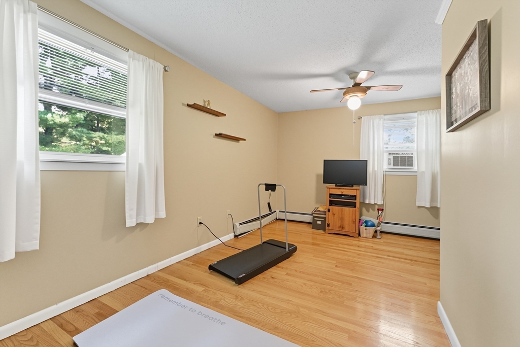 50 Martin Farms Road Hampden, MA 01036 - Photo 28 of 41 a living room with furniture and a flat screen tv