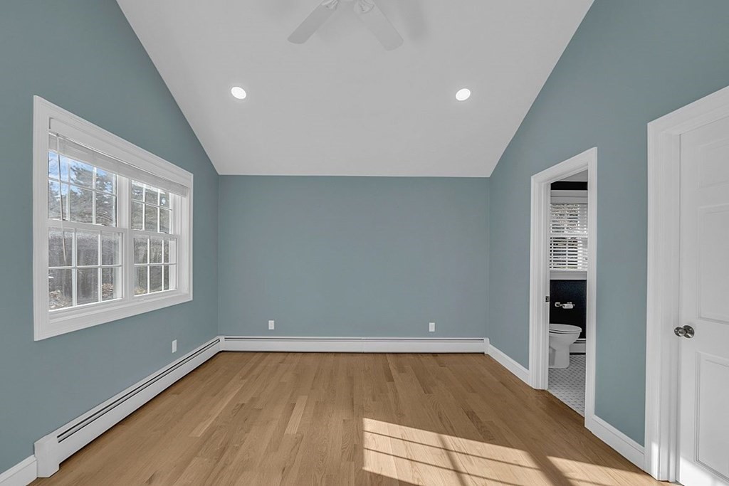4 Radcliffe Road North Chelmsford, MA 01863 - Photo 16 of 40 an empty room with wooden floor and windows