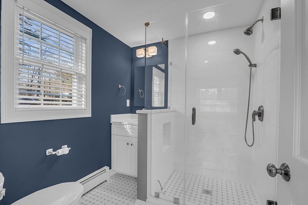 4 Radcliffe Road North Chelmsford, MA 01863 - Photo 19 of 40 a bathroom with a shower a sink and mirror